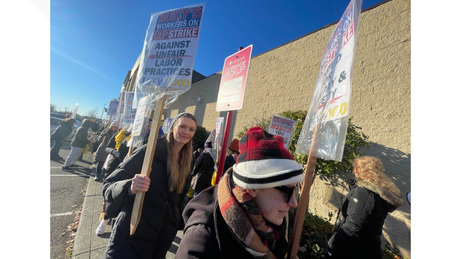 Hundreds of Macy’s department store workers went on strike Friday at three western Washington locations over what the union called unfair labor practices.